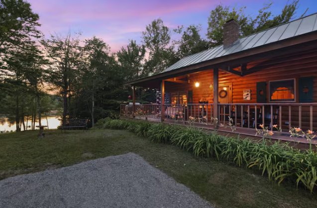 Log cabin at dusk on Highland Lake