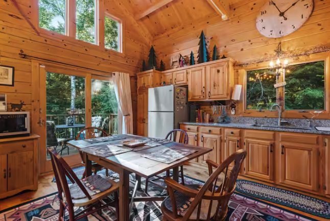 Warm log cabin kitchen and dining area