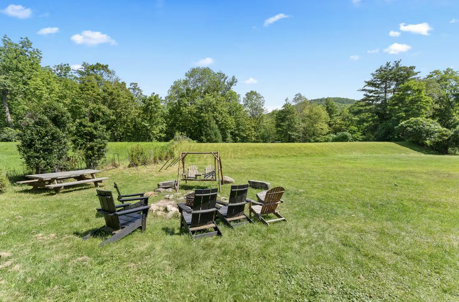 Fire pit circle with Adirondack chairs
